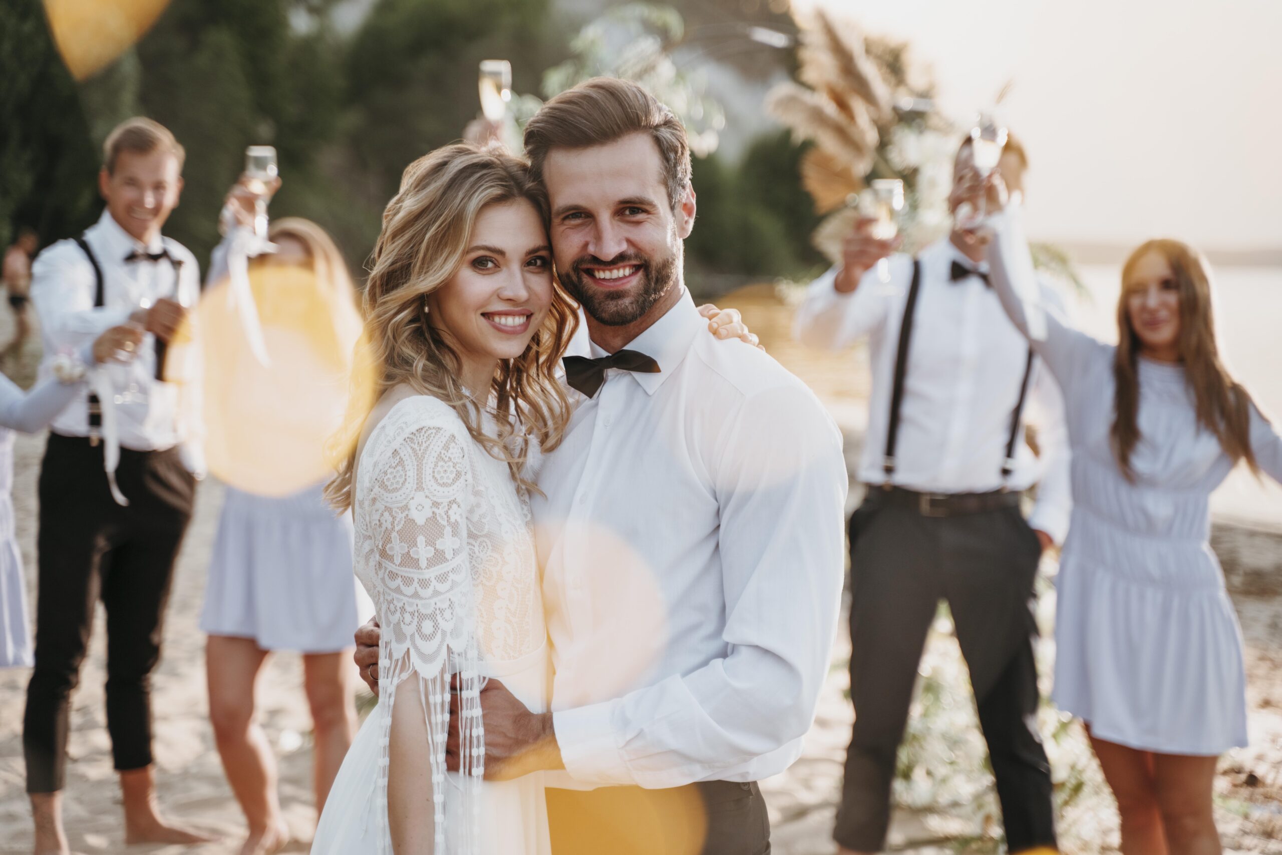 bride-groom-having-their-wedding-with-guests-beach